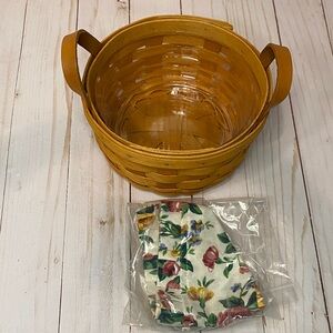 Longaberger Circular Basket comes with floral lining and plastic insert like new